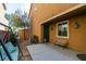 Cozy backyard patio featuring a swing, bench, grill, and a convenient pet door, perfect for relaxing and entertaining at 6470 Crest Estates St, Las Vegas, NV 89131
