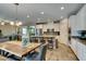 Bright, open-concept kitchen and dining area with stainless steel appliances and natural light at 6470 Crest Estates St, Las Vegas, NV 89131