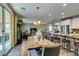 Open dining area with backyard access and open floor plan to the kitchen and living spaces at 6470 Crest Estates St, Las Vegas, NV 89131