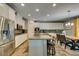Well-equipped kitchen featuring granite countertops, stainless steel appliances, and a breakfast bar at 6470 Crest Estates St, Las Vegas, NV 89131