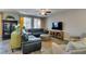 Inviting living room features stylish furniture, natural light, and a ceiling fan for added comfort at 6470 Crest Estates St, Las Vegas, NV 89131