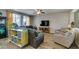 Comfortable living room features stylish furniture, natural light, and a ceiling fan for added comfort at 6470 Crest Estates St, Las Vegas, NV 89131
