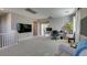 Spacious loft with neutral carpets, an office area, and lots of natural light from the windows at 6470 Crest Estates St, Las Vegas, NV 89131
