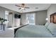 Serene main bedroom with sliding doors to a balcony and neutral decor at 6470 Crest Estates St, Las Vegas, NV 89131