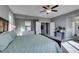 Comfortable main bedroom with balcony access, neutral decor and ceiling fan at 6470 Crest Estates St, Las Vegas, NV 89131