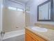 Bathroom features a shower-tub combo and wooden vanity at 6709 Barrington Hills St, Las Vegas, NV 89149