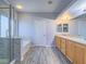 Bathroom featuring double sinks, a glass-enclosed shower, and a bathtub with tile flooring at 6709 Barrington Hills St, Las Vegas, NV 89149