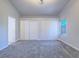Bedroom featuring neutral carpet, big closet, a ceiling fan, and a window for ample natural light at 6709 Barrington Hills St, Las Vegas, NV 89149