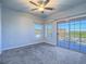 Bedroom with neutral carpet, sliding door with view, offering access to the outside and natural light at 6709 Barrington Hills St, Las Vegas, NV 89149