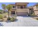 Charming two-story home featuring a spacious garage and lovely balcony, complemented by desert landscaping at 6709 Barrington Hills St, Las Vegas, NV 89149