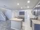 Bright eat-in kitchen offers stainless steel appliances and tiled floors at 6709 Barrington Hills St, Las Vegas, NV 89149