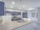 Stylish kitchen boasts granite countertops, stainless steel appliances, and plenty of cabinet storage at 6709 Barrington Hills St, Las Vegas, NV 89149