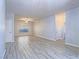 Spacious living area with tiled floors, ceiling fan, and natural light at 6709 Barrington Hills St, Las Vegas, NV 89149
