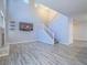 Spacious living room with staircase, fireplace, and recessed lighting at 6709 Barrington Hills St, Las Vegas, NV 89149