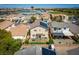 Aerial view of a home with solar panels, green backyard with patio and outdoor dining set at 6973 Pacific Coast St, Las Vegas, NV 89148