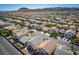 Aerial view showcasing a residential neighborhood with mountain views in the distance at 6973 Pacific Coast St, Las Vegas, NV 89148