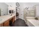 Spacious bathroom with double vanity, separate tub and shower, and a view to the bedroom at 6973 Pacific Coast St, Las Vegas, NV 89148