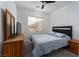Cozy bedroom with a plush carpet, neutral decor, and a window letting in natural light at 6973 Pacific Coast St, Las Vegas, NV 89148