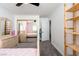 Bedroom with a built-in shelf, neutral walls, and plush carpeting for a comfortable feel at 6973 Pacific Coast St, Las Vegas, NV 89148