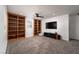 Large bonus room with carpet flooring, built-in shelving and recessed lighting at 6973 Pacific Coast St, Las Vegas, NV 89148