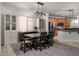 Bright dining area featuring stylish lighting and convenient access to the kitchen at 6973 Pacific Coast St, Las Vegas, NV 89148