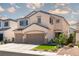 Charming two-story home features a well-manicured lawn and a two-car garage at 6973 Pacific Coast St, Las Vegas, NV 89148