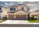 Beautiful two-story home featuring a spacious driveway and lush, green landscaping at 6973 Pacific Coast St, Las Vegas, NV 89148