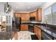 Modern kitchen with stainless steel appliances, granite countertops, and ample cabinet space at 6973 Pacific Coast St, Las Vegas, NV 89148