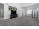 Spacious living room with new gray carpet, light walls, and plenty of natural light at 6973 Pacific Coast St, Las Vegas, NV 89148