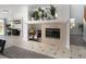 Cozy living area with fireplace, tile flooring, and seamless access to the backyard at 6973 Pacific Coast St, Las Vegas, NV 89148