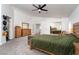 Open main bedroom with carpet, featuring double doors, large dresser, and barn door to ensuite at 6973 Pacific Coast St, Las Vegas, NV 89148