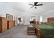 Large main bedroom with carpet, featuring a sitting area and double doors to an office at 6973 Pacific Coast St, Las Vegas, NV 89148