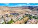 Overhead view of modern homes with pools and desert landscaping against a mountain landscape at 7 Hilltop Crest St, Henderson, NV 89011