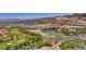 Expansive aerial view of Lake Las Vegas showcasing its stunning architecture, golf course, and surrounding landscape at 7 Hilltop Crest St, Henderson, NV 89011