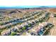 Overhead shot of neighborhood featuring stylish homes with desert landscaping against a mountain backdrop at 7 Hilltop Crest St, Henderson, NV 89011