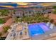 Stunning backyard showcasing a refreshing pool, cozy fire pit, and ample seating for relaxation and entertainment at 7 Hilltop Crest St, Henderson, NV 89011
