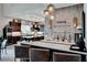 Close-up of the bar area with dark cabinetry and decorative accents and counter seating at 7 Hilltop Crest St, Henderson, NV 89011