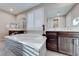 Bathroom featuring a soaking tub with modern tile accent, dual vanities, and tile floors at 7 Hilltop Crest St, Henderson, NV 89011