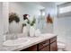 Bathroom featuring double sinks, granite countertops, and decorative accents at 7 Hilltop Crest St, Henderson, NV 89011