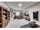 Versatile bonus room with exercise equipment, desk area, and ample display shelving at 7 Hilltop Crest St, Henderson, NV 89011