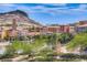 Scenic view of a luxury community with beautiful landscaping and views of the surrounding mountains at 7 Hilltop Crest St, Henderson, NV 89011