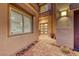 Inviting home entrance with a brick path and a stylish front door with modern hardware at 7 Hilltop Crest St, Henderson, NV 89011