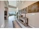 Grand foyer with high ceilings, art displays, and stylish decor leading to an outdoor dining area at 7 Hilltop Crest St, Henderson, NV 89011
