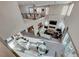 Spacious living area with a stone fireplace, high ceilings, and ample natural light at 7 Hilltop Crest St, Henderson, NV 89011