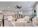 Inviting loft space with seating, a wooden table, and natural light from surrounding windows at 7 Hilltop Crest St, Henderson, NV 89011