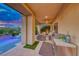 Stylish outdoor patio featuring comfortable seating, a built-in grill, and a beautiful pool area at 7 Hilltop Crest St, Henderson, NV 89011
