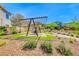 Peaceful picnic area under a modern pergola, nestled within beautifully landscaped grounds and winding pathways at 7 Hilltop Crest St, Henderson, NV 89011