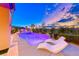 Lounge by the pool and enjoy the desert sunset from this modern backyard oasis at 7 Hilltop Crest St, Henderson, NV 89011