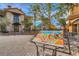Charming street view showcases the entrance to a shopping center with landscaped features and welcoming atmosphere at 7 Hilltop Crest St, Henderson, NV 89011