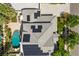 Stunning aerial view of home featuring a private pool, solar panels, and lush landscaping at 7460 Grassy Field Ct, Las Vegas, NV 89131